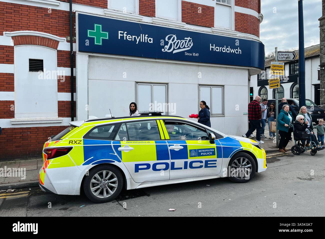 A Metropolitan Police Car outside of Greater London in the Seaside Village of Mumbles, parked outside Boots Pharmacy. 22nd March 2025. - Smartphone Captured Stock Image