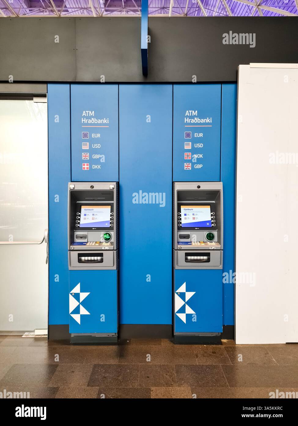 Keflavik, Iceland 23. June 2024, Two blue ATMs of Hradbanki at Keflavik  Airport are displaying EUR, USD, GBP, NOK and DKK currencies Stock Photo -  Alamy