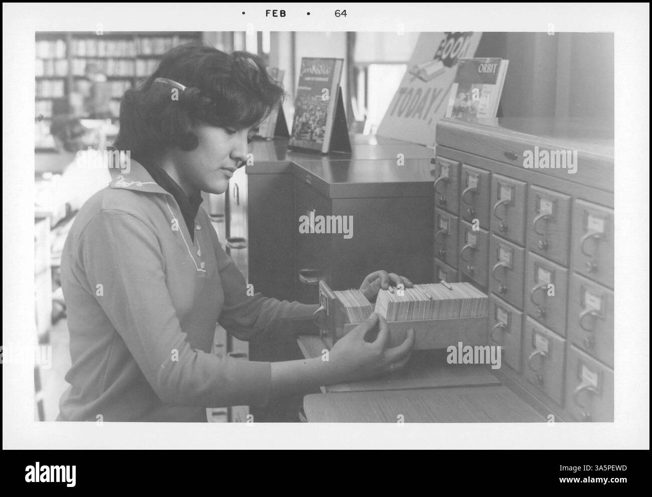 A 1964 photo of an elementary school student learning to use the