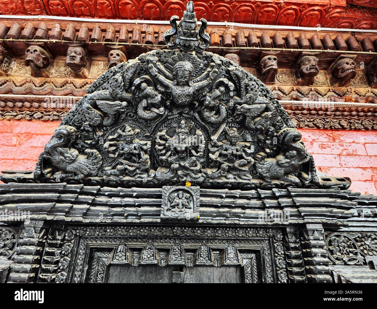 Detailed artwork at the Shree Tanadevi Tarani Bhawani Temple in Kathmandu, Nepal. - Smartphone Captured Stock Image