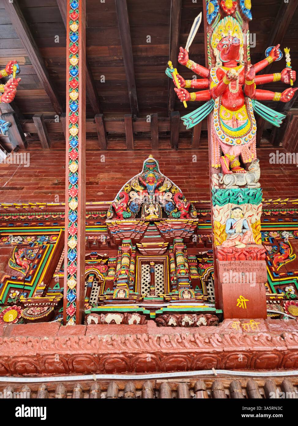 Detailed artwork at the Shree Tanadevi Tarani Bhawani Temple in Kathmandu, Nepal. - Smartphone Captured Stock Image