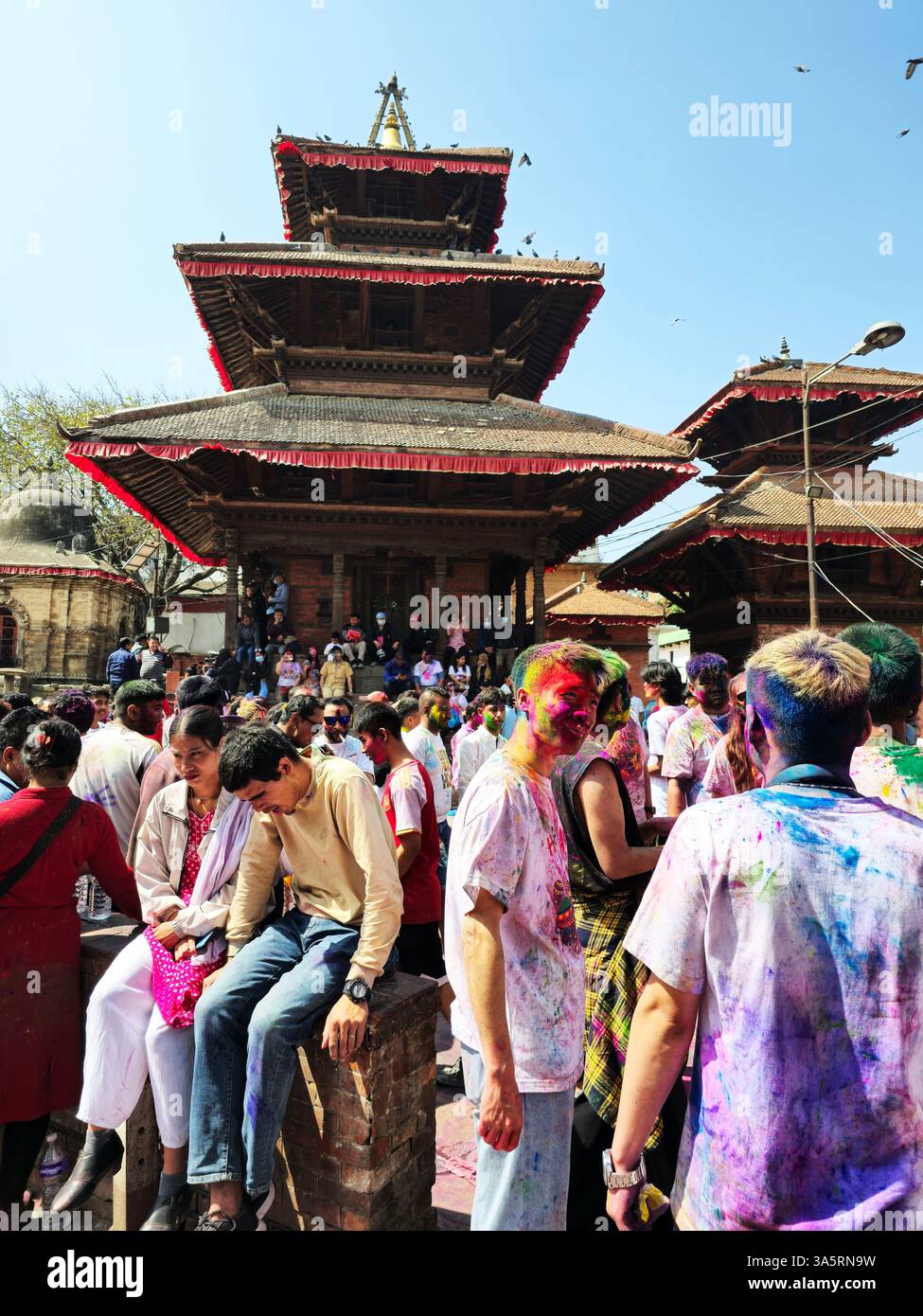 Celebrating the Holi festival at the Durbar Square in Kathmandu, Nepal. - Smartphone Captured Stock Image
