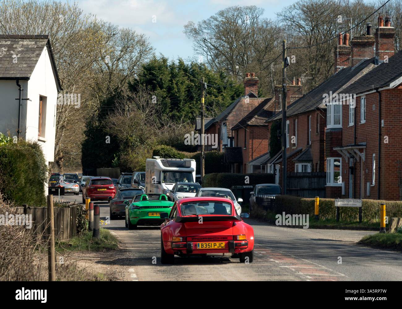 Cheriton Winchester Hampshire England UK. 18.03.2025. Upmarket sports cars driving through Cheriton on the A272 road near Winchester. Stock Photo