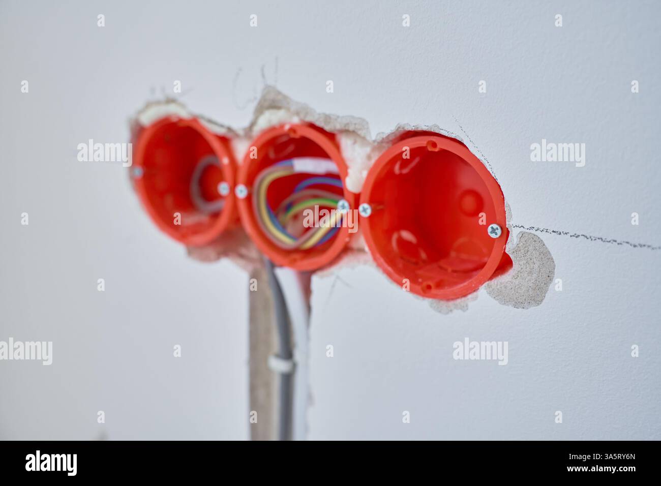 Electrical wiring installation during renovation. Plastic outlet boxes