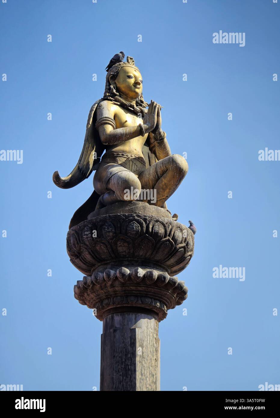 Golden statue of Garuda at the Durbar square in Patan, Nepal. - Smartphone Captured Stock Image