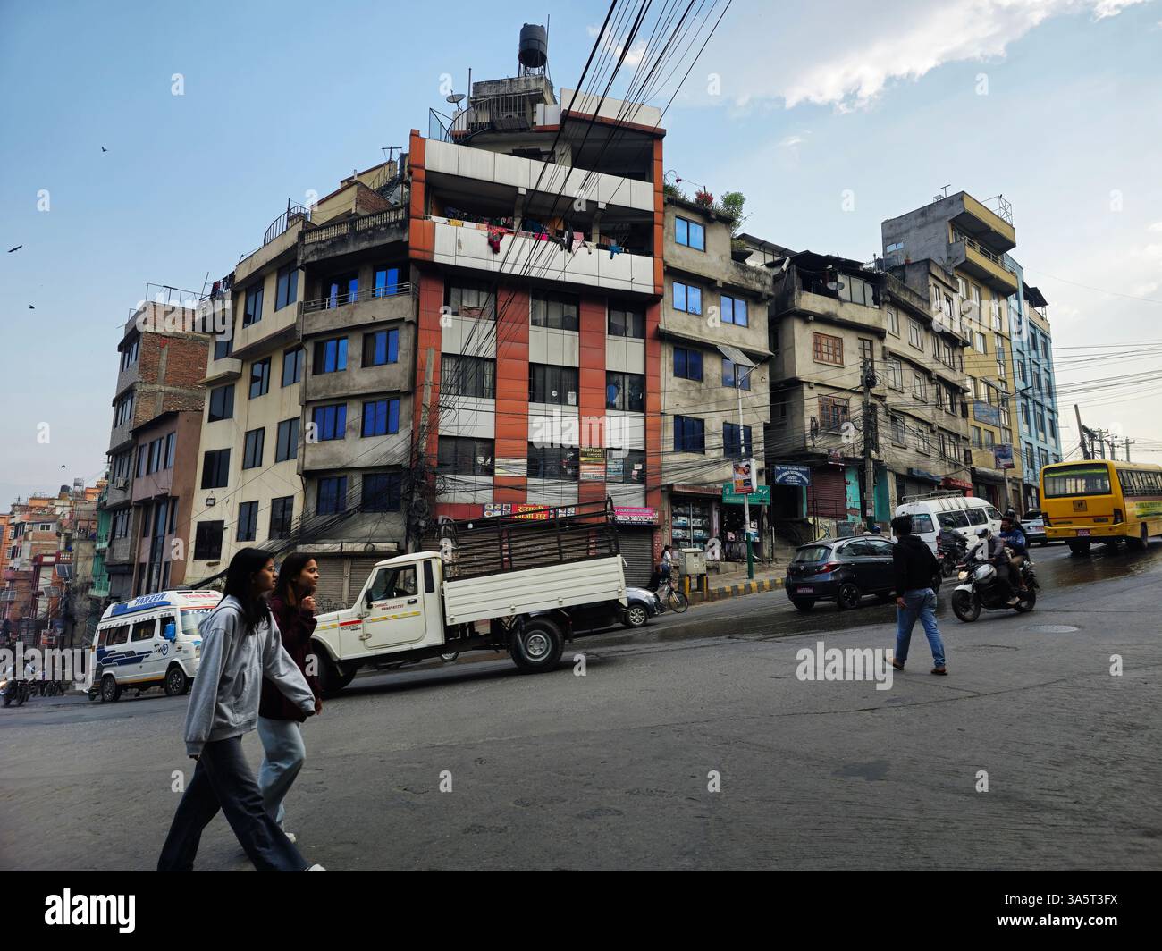 Young Nepali women walking on Leknath Marg on the border of the Thamel neighborhood in Kathmandu, Nepal. - Smartphone Captured Stock Image
