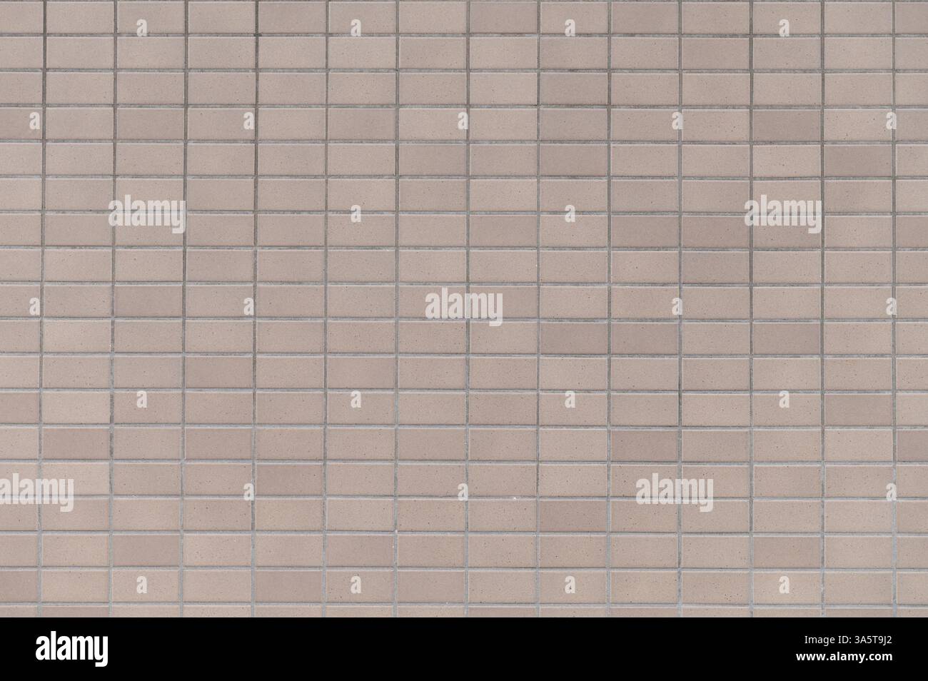 Beige ceramic clay tile brick wall background Stock Photo