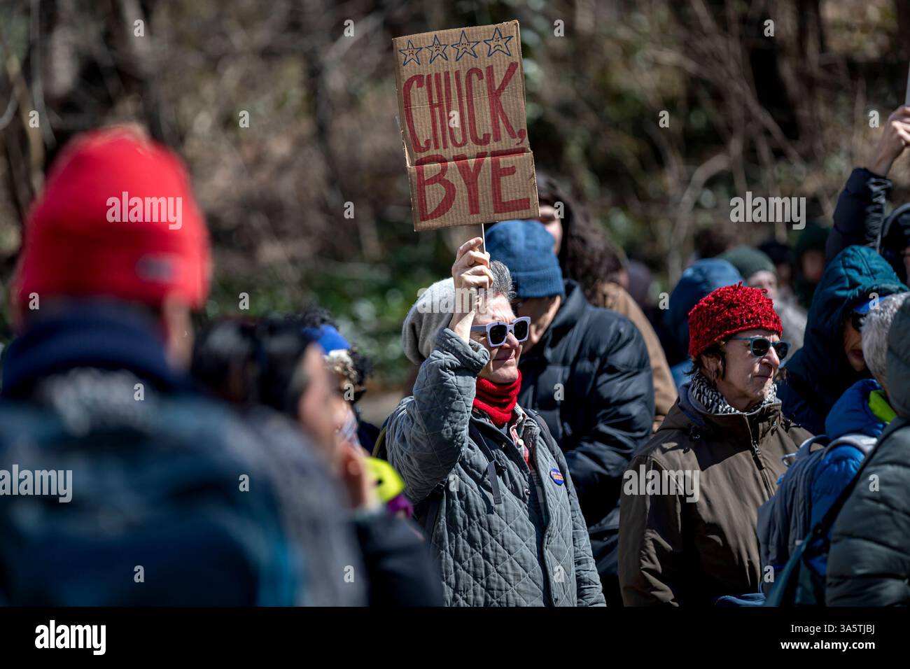 New York City, United States. 23rd Mar, 2025. Hundreds rally outside of Senate Minority Leader Chuck Schumer's (D-NY) home. Protestors are calling for Schumer to resign after what they call 'a devastating lack of leadership' after he voted for a GOP-written funding patch to avert a government shutdown, claiming it was the better of two bad options. (Photo by Michael Nigro/Pacific Press) Credit: Pacific Press Media Production Corp./Alamy Live News Stock Photo