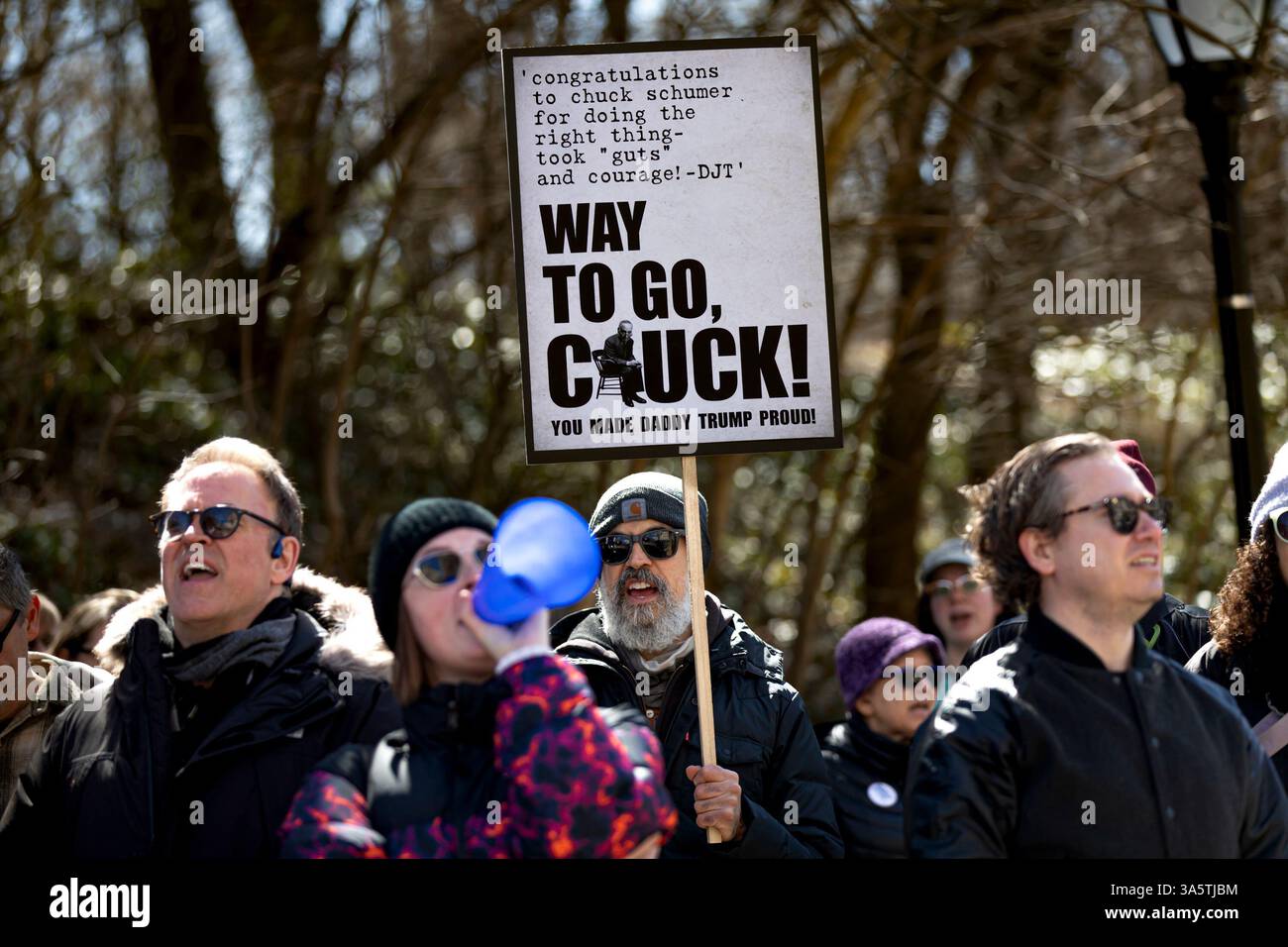 New York City, United States. 23rd Mar, 2025. Hundreds rally outside of Senate Minority Leader Chuck Schumer's (D-NY) home. Protestors are calling for Schumer to resign after what they call 'a devastating lack of leadership' after he voted for a GOP-written funding patch to avert a government shutdown, claiming it was the better of two bad options. (Photo by Michael Nigro/Pacific Press) Credit: Pacific Press Media Production Corp./Alamy Live News Stock Photo