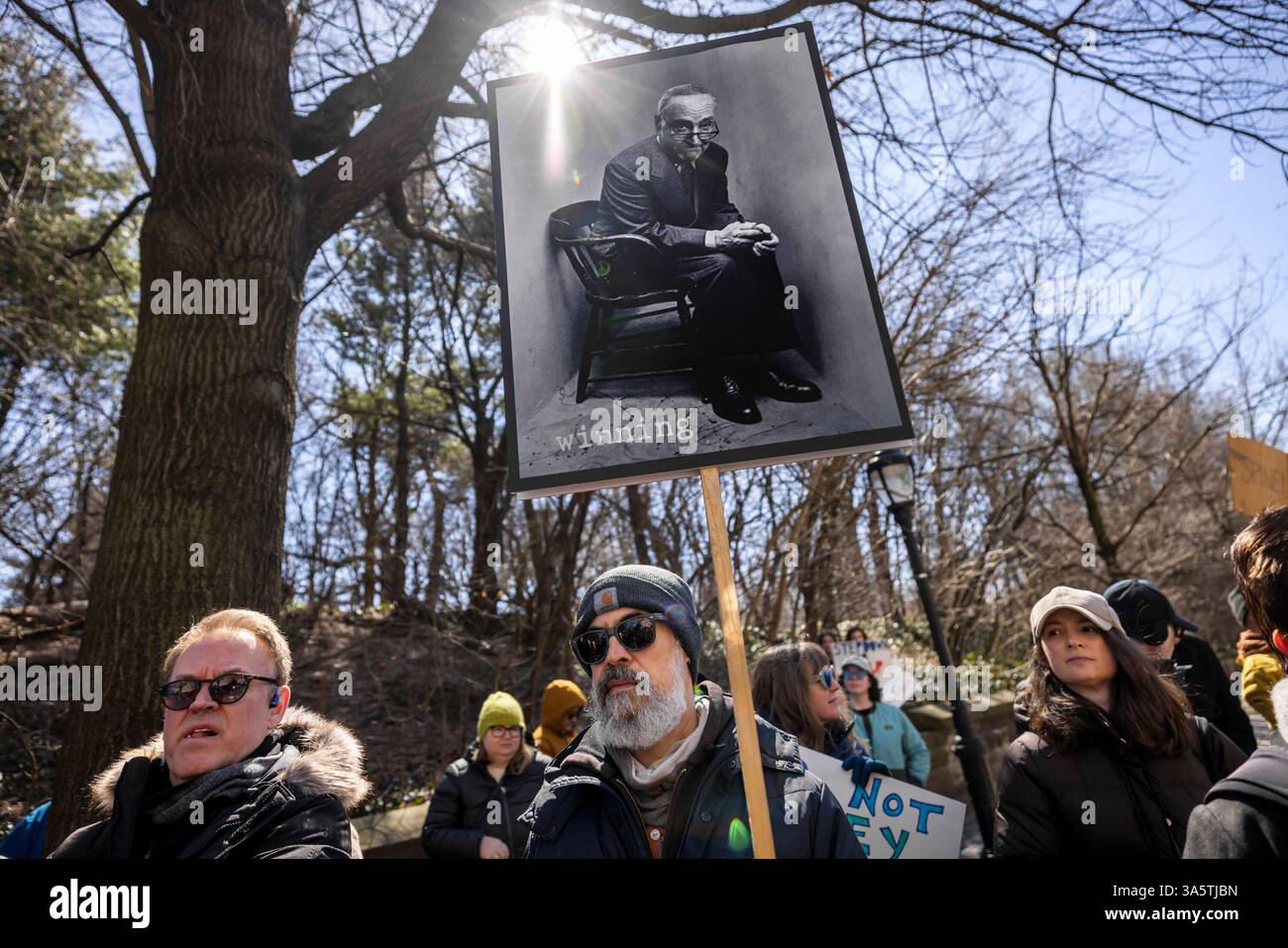 New York City, United States. 23rd Mar, 2025. Hundreds rally outside of Senate Minority Leader Chuck Schumer's (D-NY) home. Protestors are calling for Schumer to resign after what they call 'a devastating lack of leadership' after he voted for a GOP-written funding patch to avert a government shutdown, claiming it was the better of two bad options. (Photo by Michael Nigro/Pacific Press) Credit: Pacific Press Media Production Corp./Alamy Live News Stock Photo