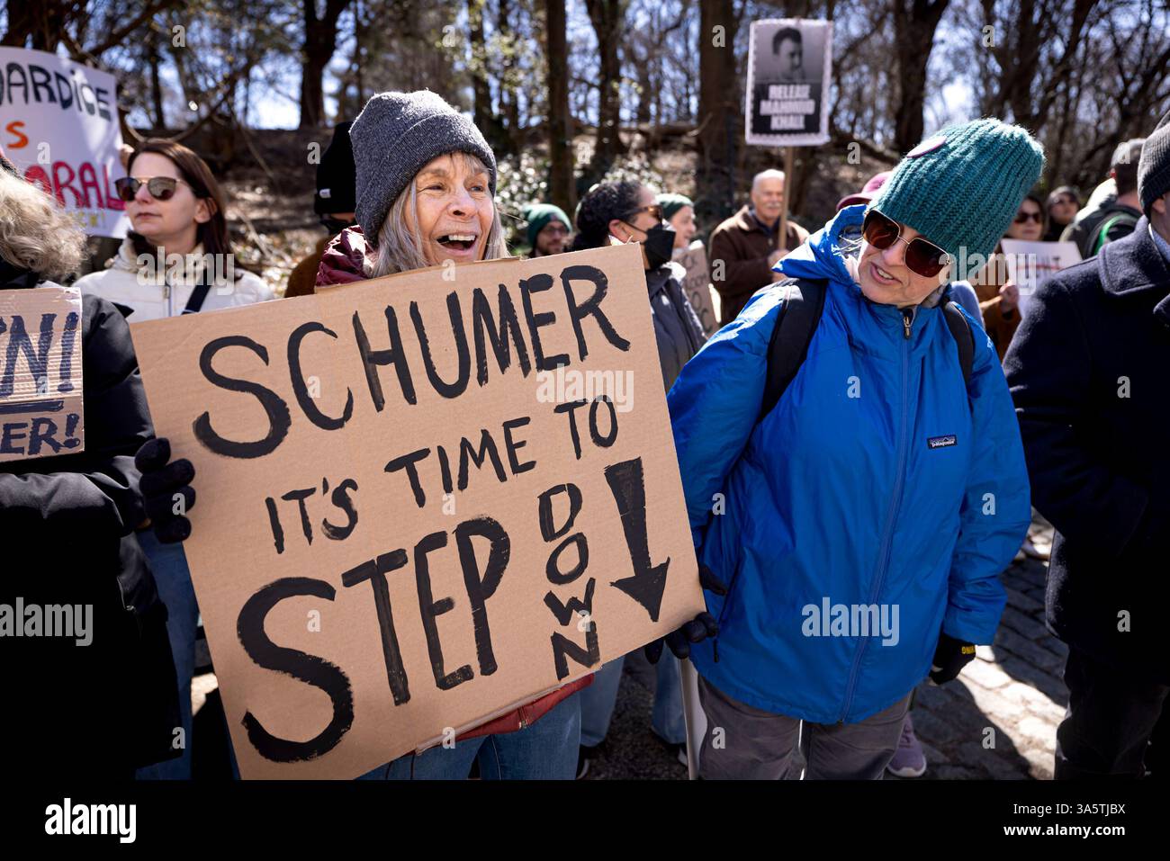 New York City, United States. 23rd Mar, 2025. Hundreds rally outside of Senate Minority Leader Chuck Schumer's (D-NY) home. Protestors are calling for Schumer to resign after what they call 'a devastating lack of leadership' after he voted for a GOP-written funding patch to avert a government shutdown, claiming it was the better of two bad options. (Photo by Michael Nigro/Pacific Press) Credit: Pacific Press Media Production Corp./Alamy Live News Stock Photo
