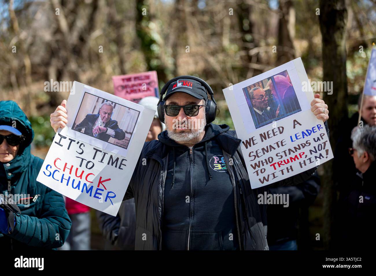 New York City, United States. 23rd Mar, 2025. Hundreds rally outside of Senate Minority Leader Chuck Schumer's (D-NY) home. Protestors are calling for Schumer to resign after what they call 'a devastating lack of leadership' after he voted for a GOP-written funding patch to avert a government shutdown, claiming it was the better of two bad options. (Photo by Michael Nigro/Pacific Press) Credit: Pacific Press Media Production Corp./Alamy Live News Stock Photo