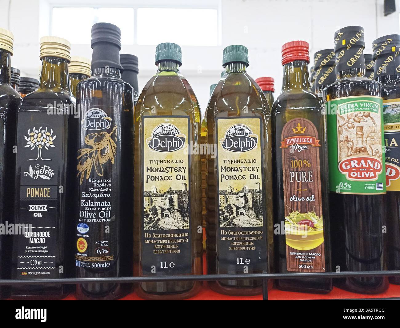 Assorted Oil Assorted olive oil bottles display in grocery store aisle Stock Photo ...