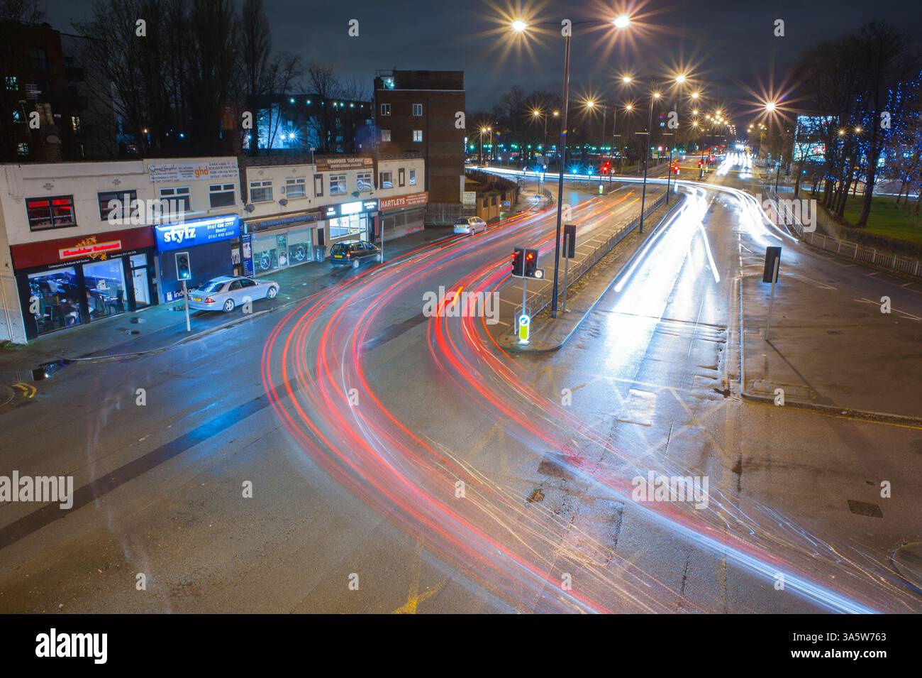 A long exposure image of the junction of the A34 (Kingsway) and the B5095 (Manchester Road) looking north towards Manchester city centre. Stock Photo