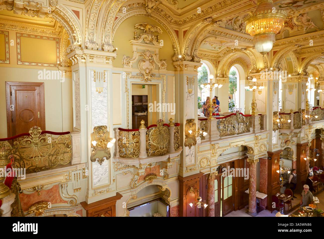 Budapest, Hungary - August 1, 2024: tourists having breakfast in te famous New York Cafe Stock Photo