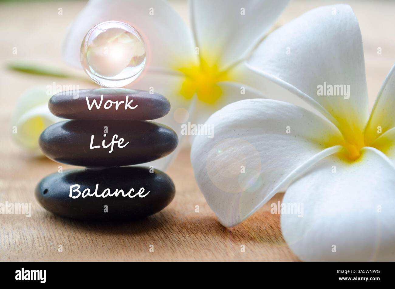 Work Life Balance text on black zen stones with shining marbles. Work ...