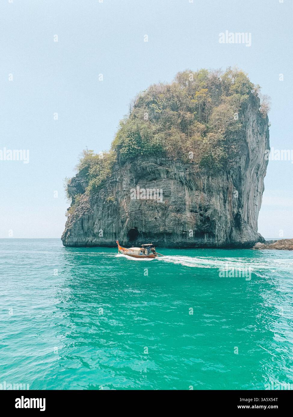 Phi Phi Islands, Thailand – Scenic Tropical Paradise with a Boat on the Water - Smartphone Captured Stock Image