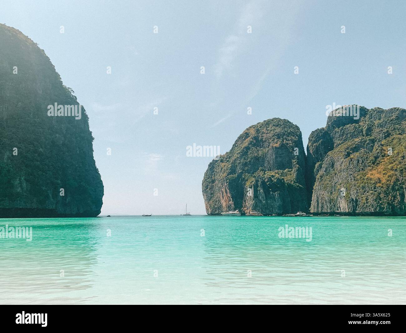 Phi Phi Islands, Thailand – Scenic Tropical Paradise with a Boat on the Water - Smartphone Captured Stock Image