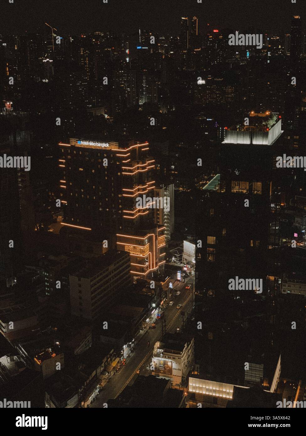 Aerial View of Bangkok Streets at Night – Vibrant City Lights and Urban Energy - Smartphone Captured Stock Image