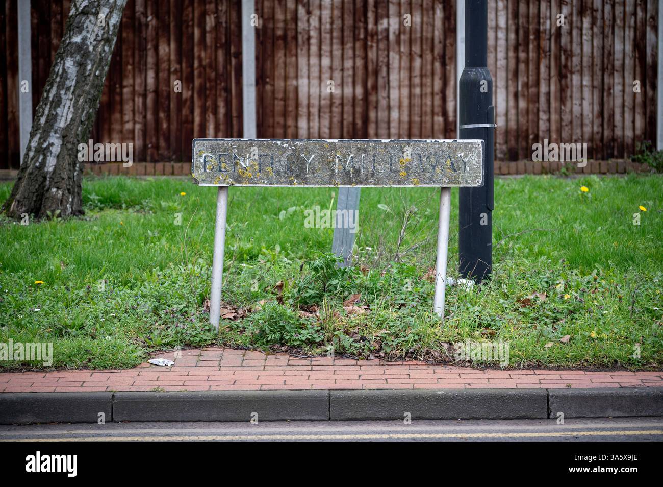 Street sign name obscured by years of layered dirt, Willenhall, West, Midlands Stock Photo