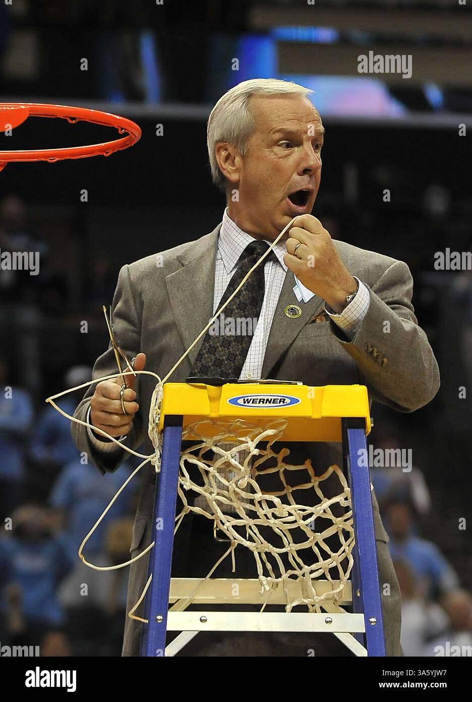 March 29, 2008 - North Carolina head coach Roy Williams is surprised that he pulled the entire net off the rim when he was only after a strand following the team's victory over the Louisville Cardinals in the NCAA East Regional final on Saturday, March 29, 2008, at Charlotte Bobcats Arena in Charlotte, North Carolina. (Todd Sumlin/Charlotte Observer/MCT) (Credit Image: © Todd Sumlin/MCT/ZUMAPRESS.com) Stock Photo