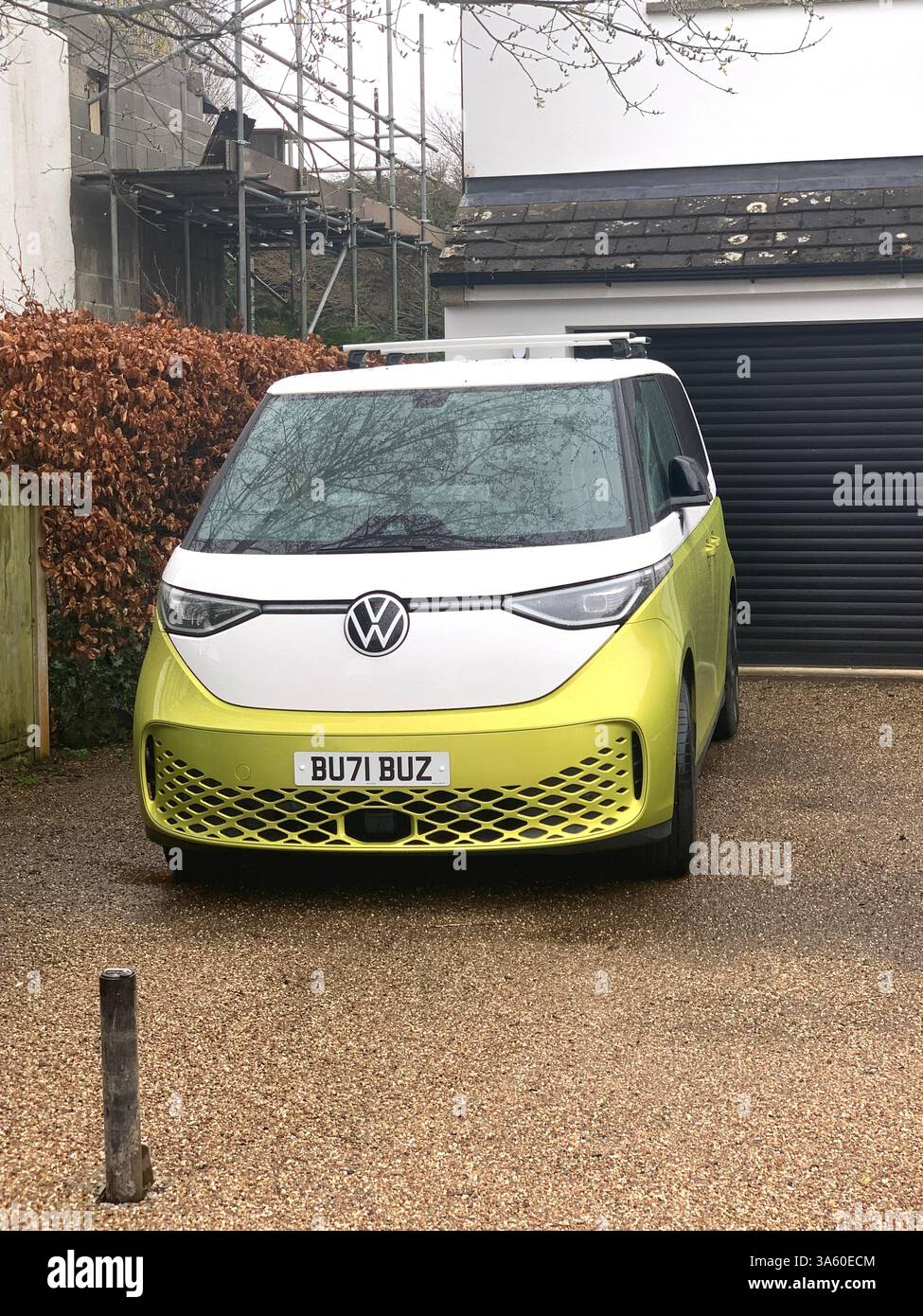 Guiseley Camper van VW Electric posh nice holiday vehicle sleep sleeper sleeping design German drive colour yellow white outside driveway - Smartphone Captured Stock Image