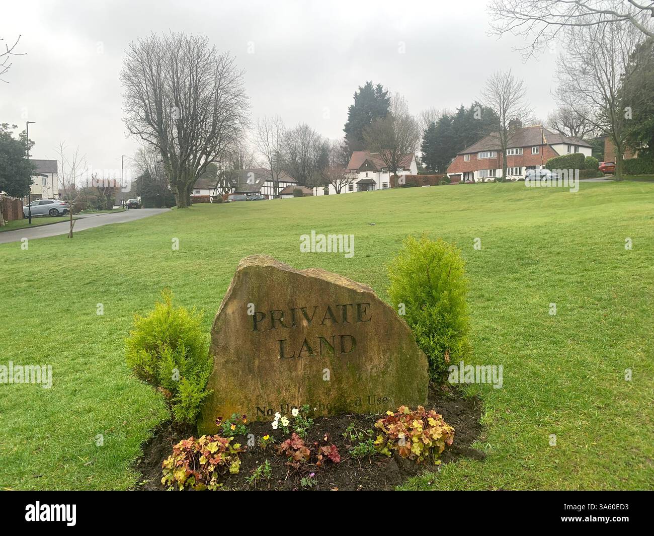 Guiseley houses homes home living life big large property lifestyle nice posh drive white painted wet cold weather Spring sign signs street road path - Smartphone Captured Stock Image