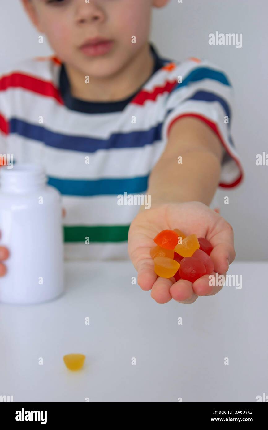 Boy eats jelly beans hi-res stock photography and images - Alamy