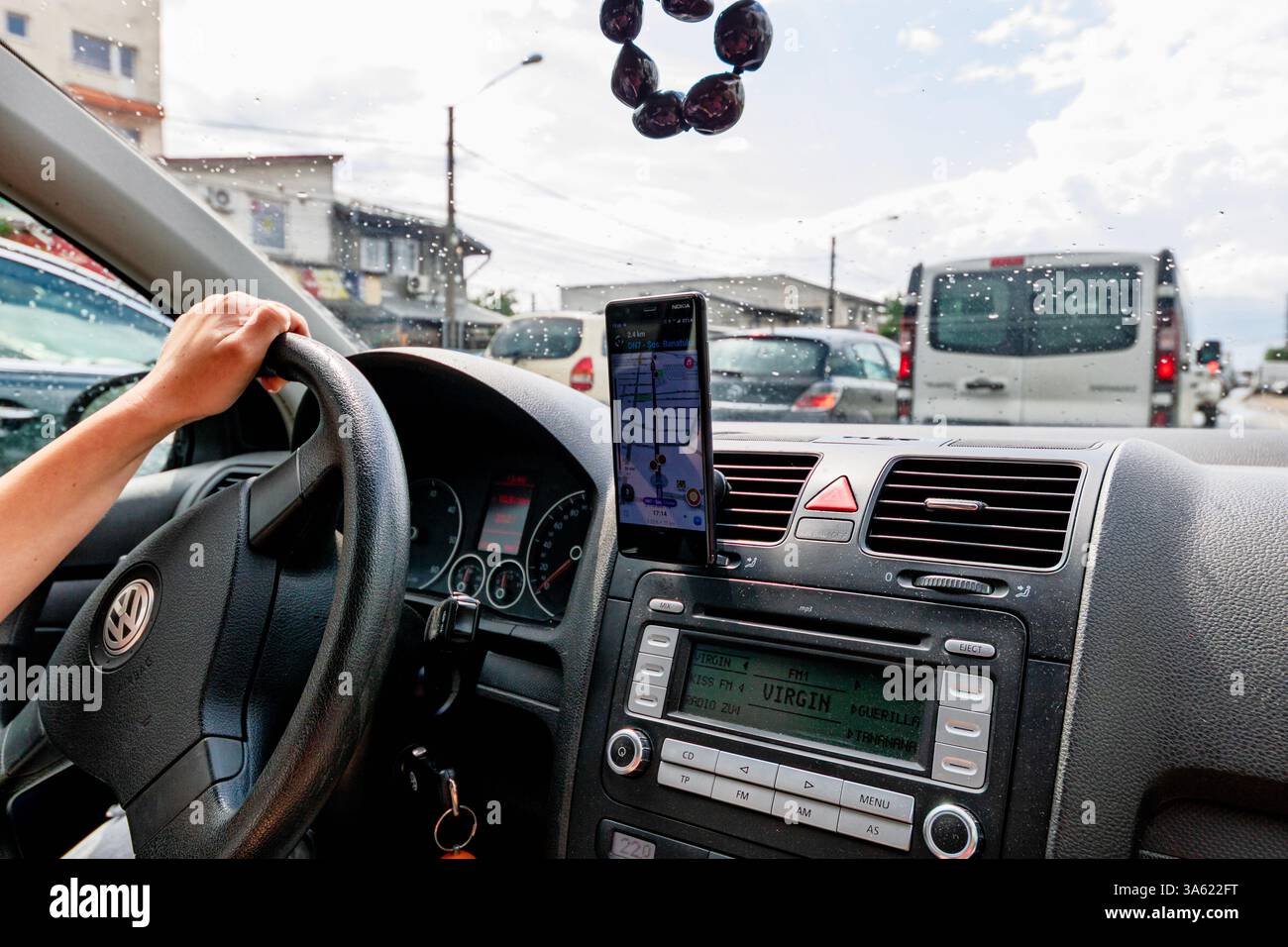 Using Waze maps application on smartphone on car dashboard Stock Photo ...