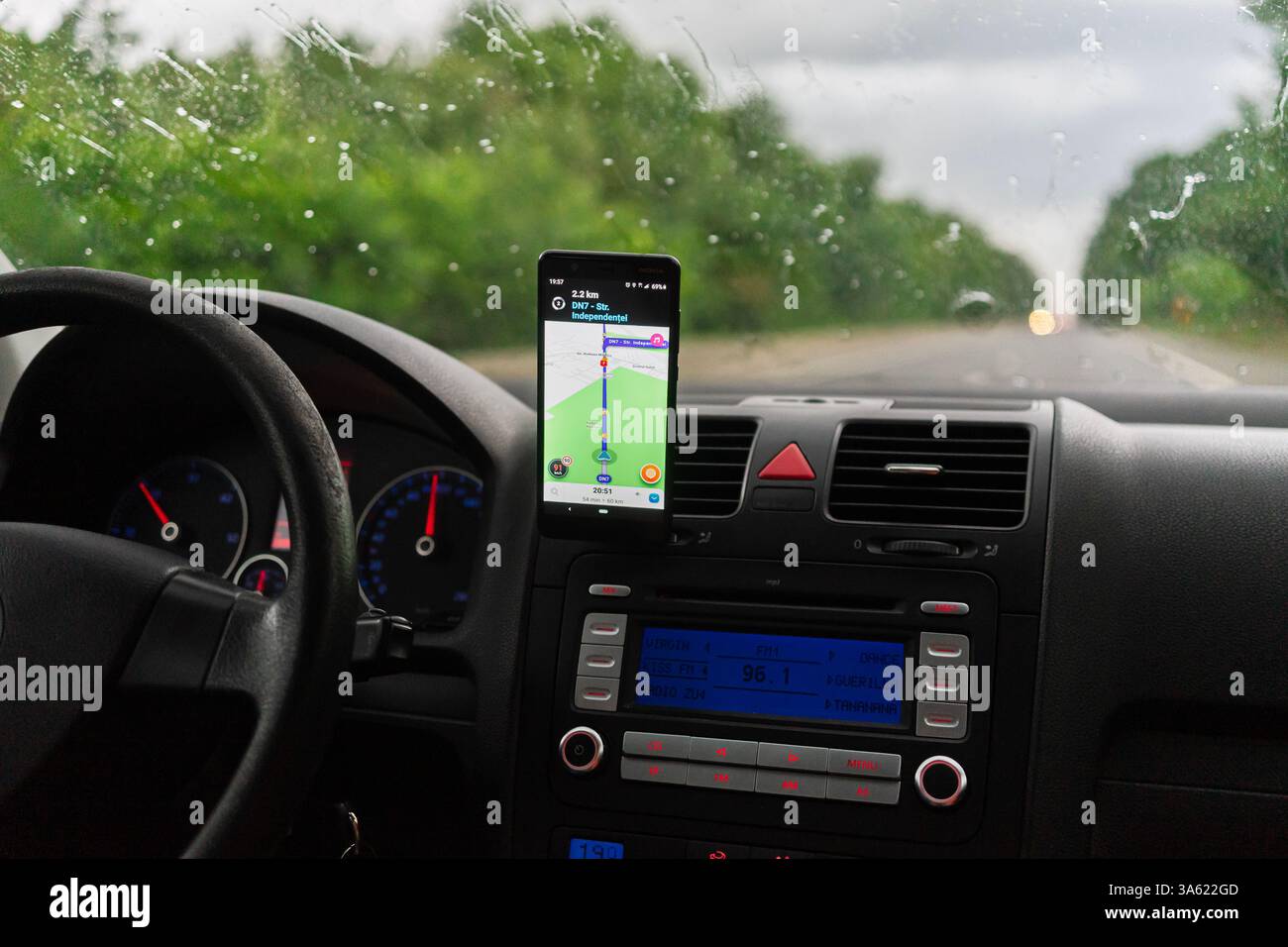 Using Waze maps application on smartphone on car dashboard Stock Photo ...