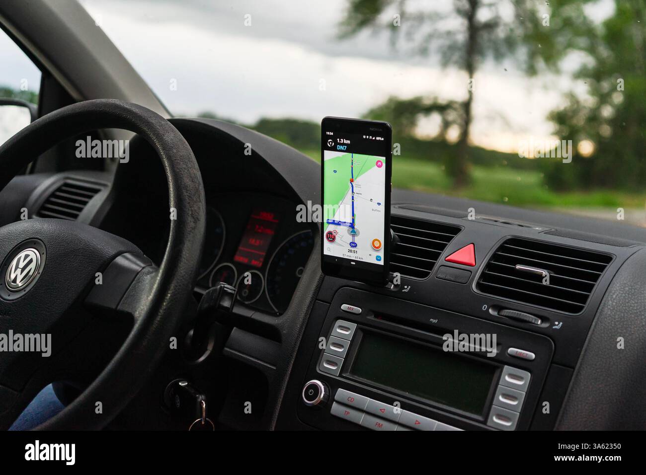 Using Waze maps application on smartphone on car dashboard Stock Photo ...
