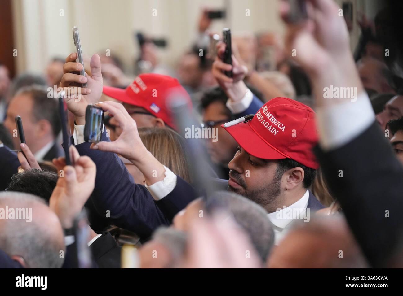 Attendees record with their phones as President Donald Trump attends a ...