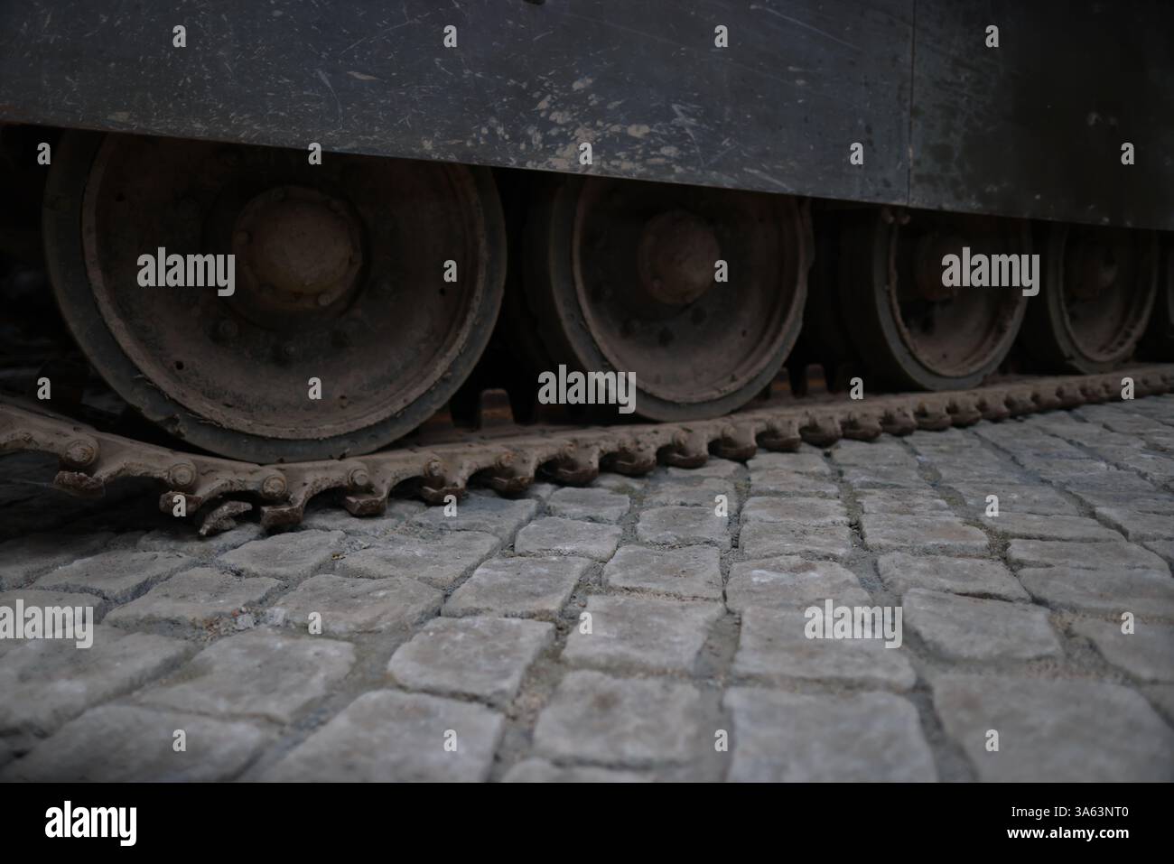 An extreme shot of a fixed battle tank track at an unknown location. For background. Stock Photo