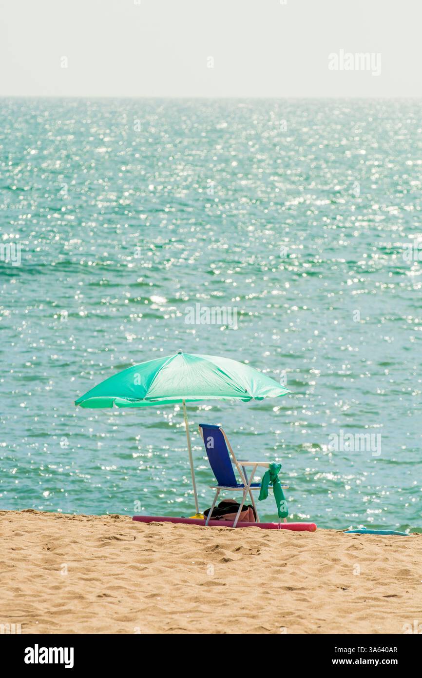 Beach umbrellas on Praia da Gaivota, Quarteira, Faro District, Portugal, Europe. Stock Photo