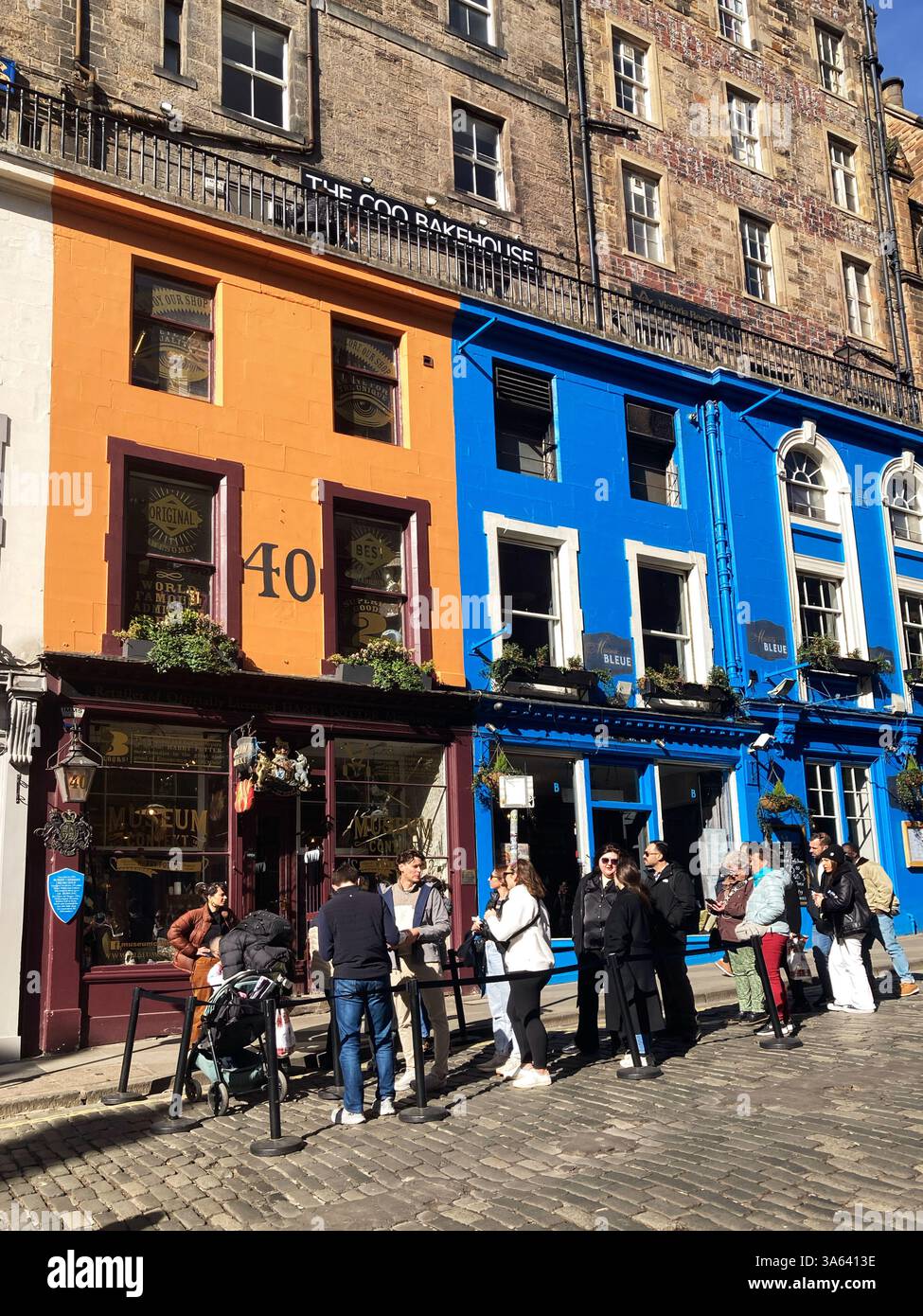 Queues awaiting entry outside the Harry Potter Museum, Victoria Street Edinburgh, Scotland - Smartphone Captured Stock Image