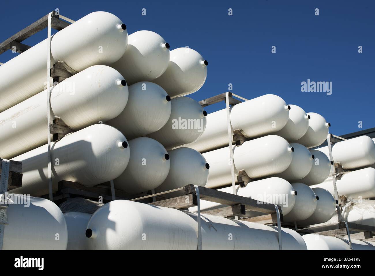 White industrial butan bottles.Compressed natural gas Stock Photo - Alamy