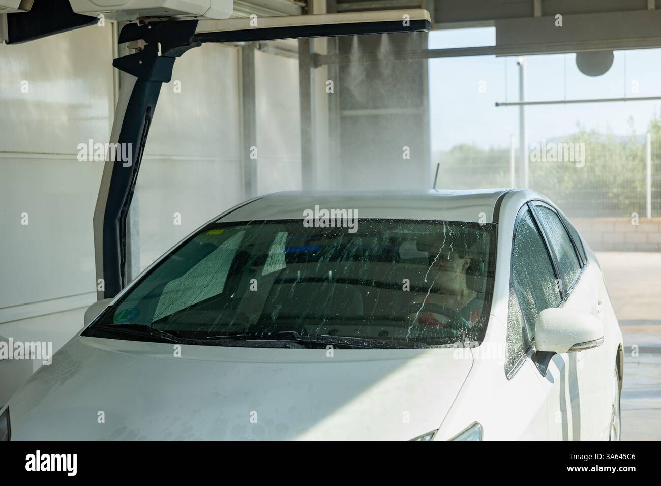 Car washing in automobile laundry Stock Photo - Alamy