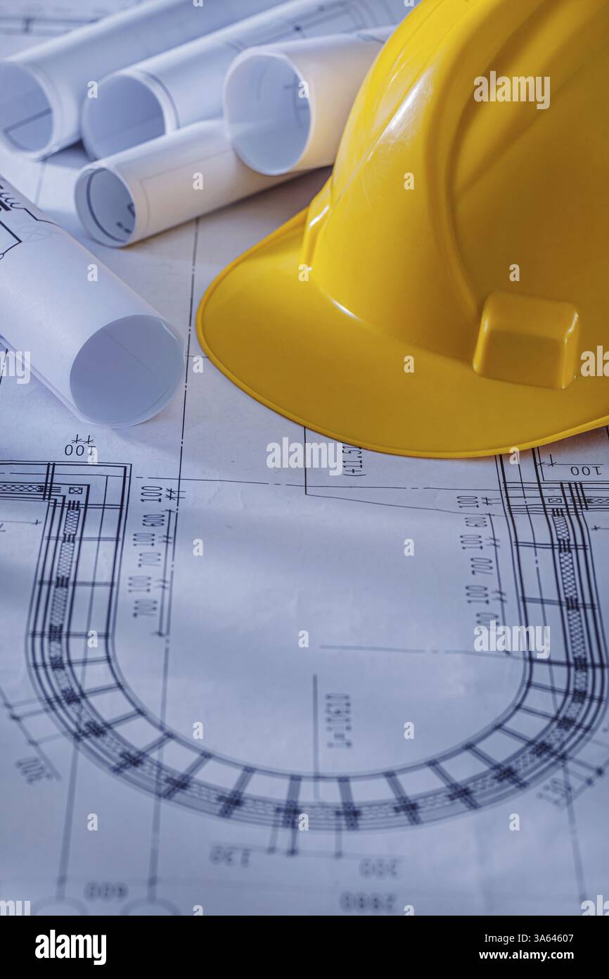 Close Up View Construction Helmet And Rolled Blueprints Stock Photo - Alamy