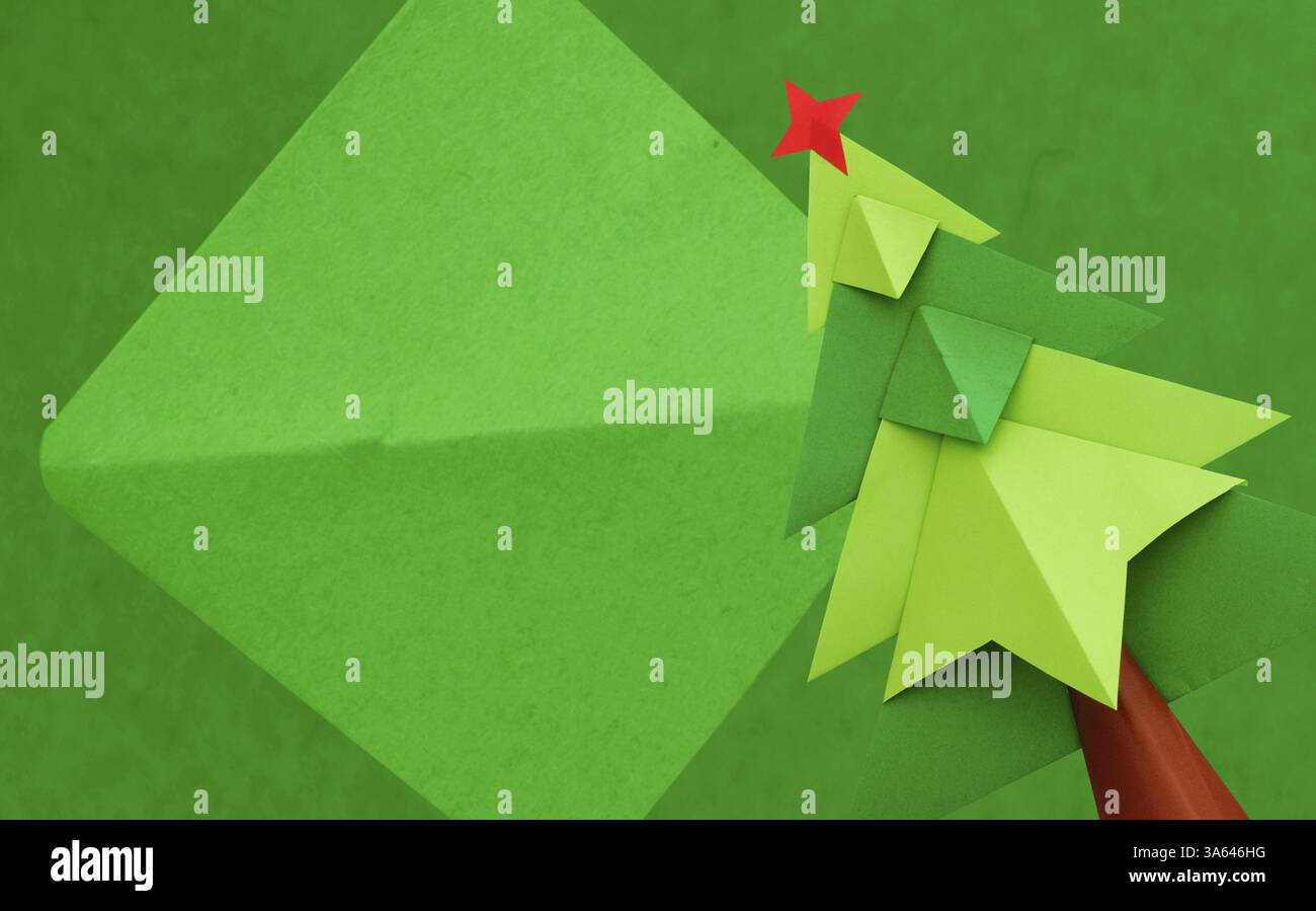 Christmas tree over green paper background. Origami made Stock Photo ...