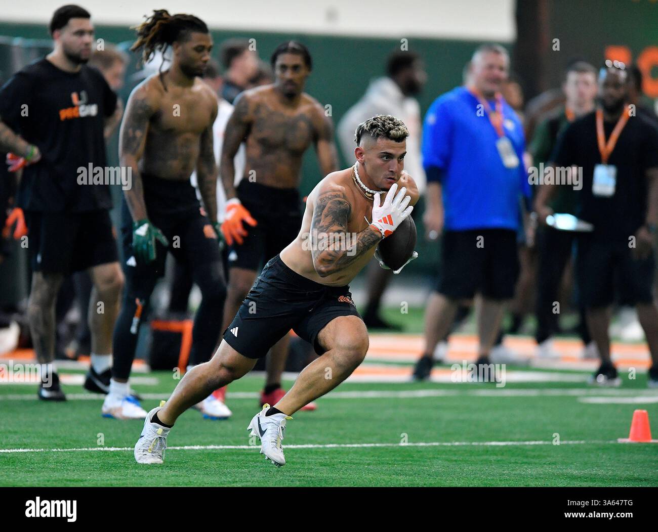 Miami receiver Xavier Restrepo runs a drill during the school's NFL