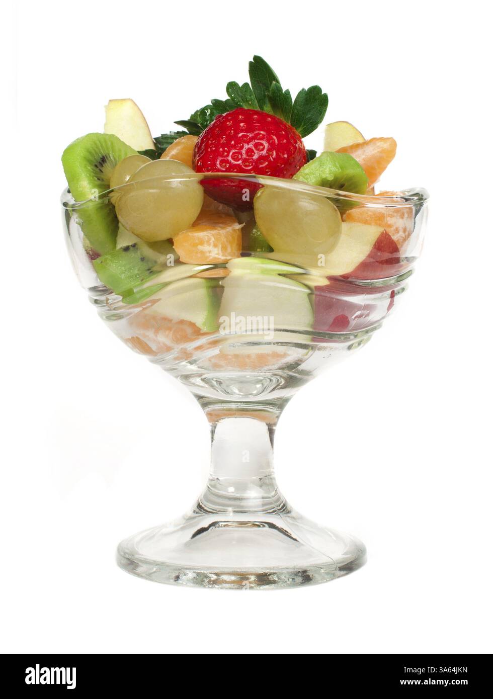 Fruit salad in a glass bowl on white background Stock Photo - Alamy