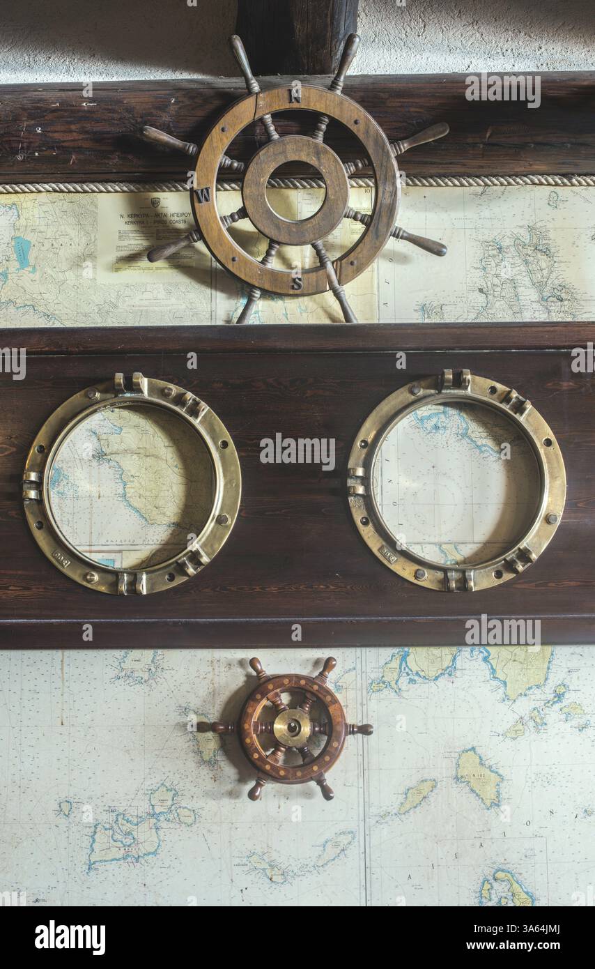 Greek Rudder Boat details on wall. Vintage map and rudder. Greece Stock Photo - Alamy