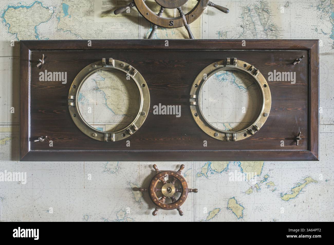 Greek Rudder Boat details on wall. Vintage map and rudder. Greece Stock Photo - Alamy