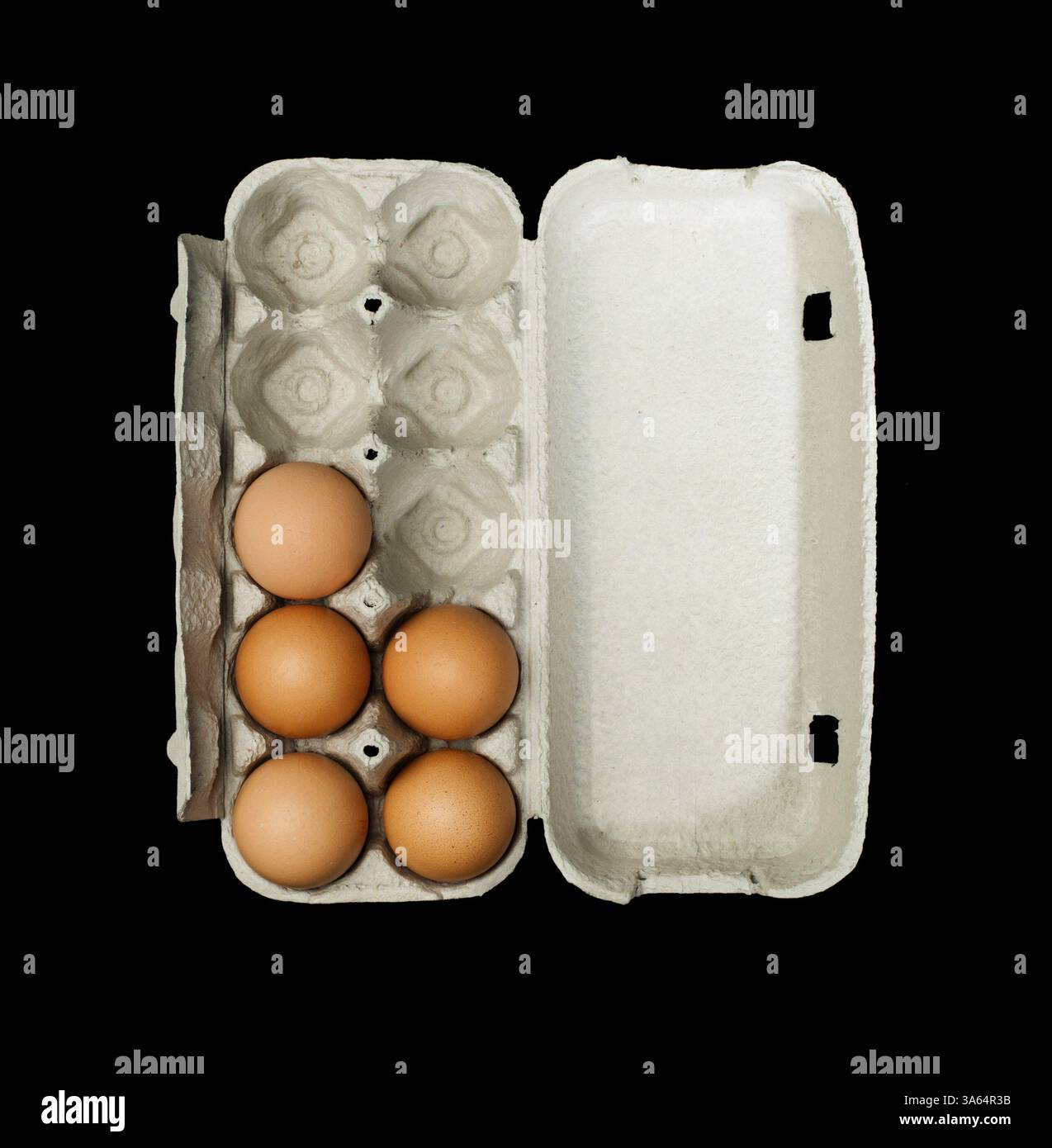 Eggs box and aggs inside. Isolated on black background Stock Photo