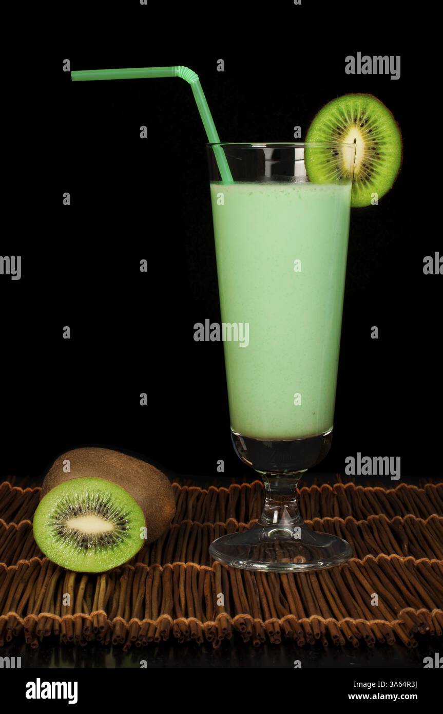 Kiwi milk shake and fresh fruit kiwi. Cocktail with milk. White ...