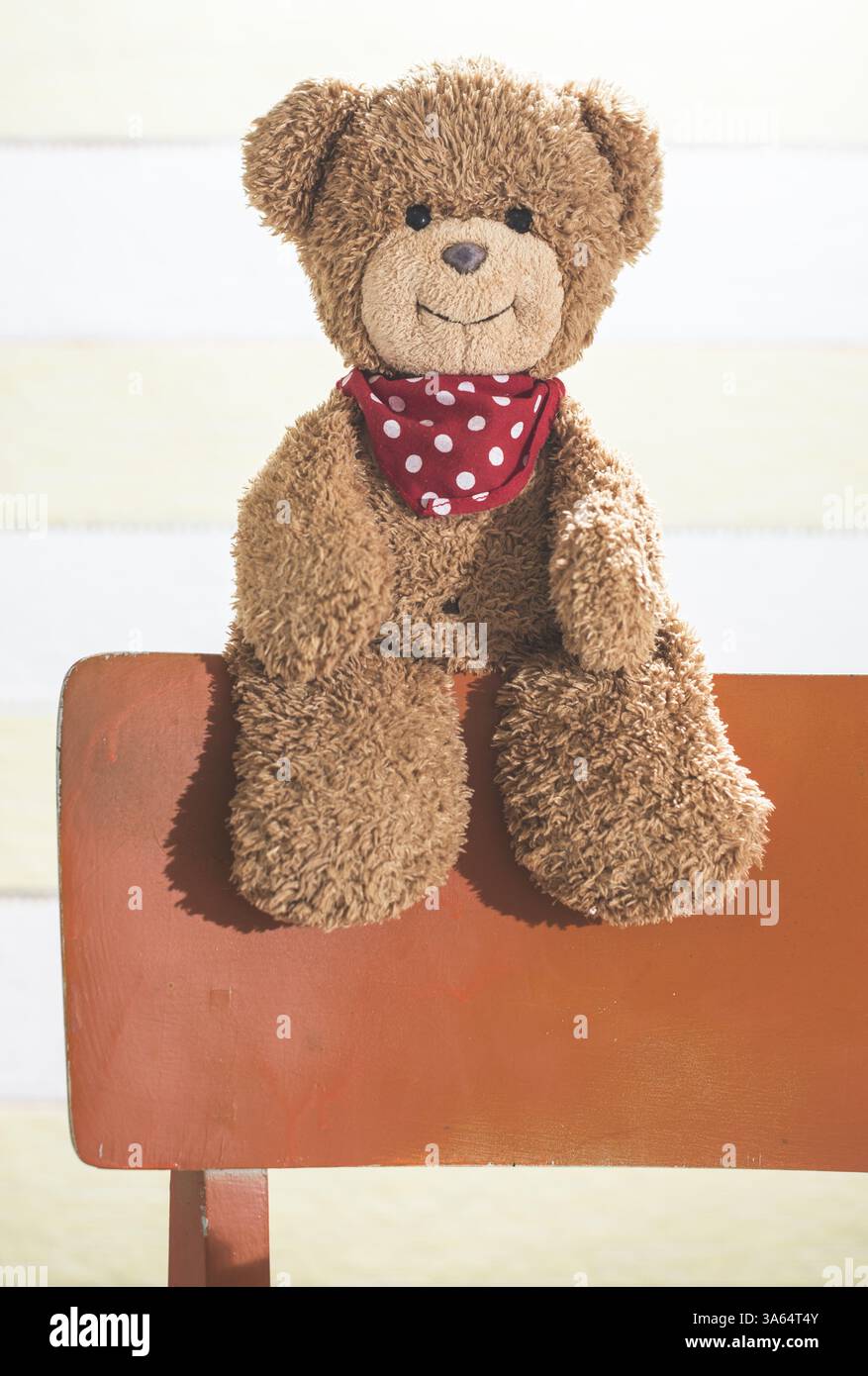 Teddy bear in a baby room on chair Stock Photo - Alamy