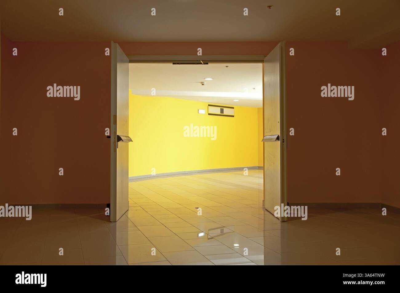 Two opened doors and yellow walls Stock Photo