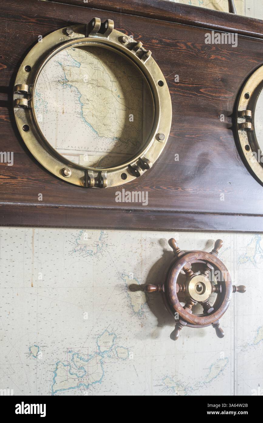 Greek Rudder Boat details on wall. Vintage map and rudder. Greece Stock Photo - Alamy