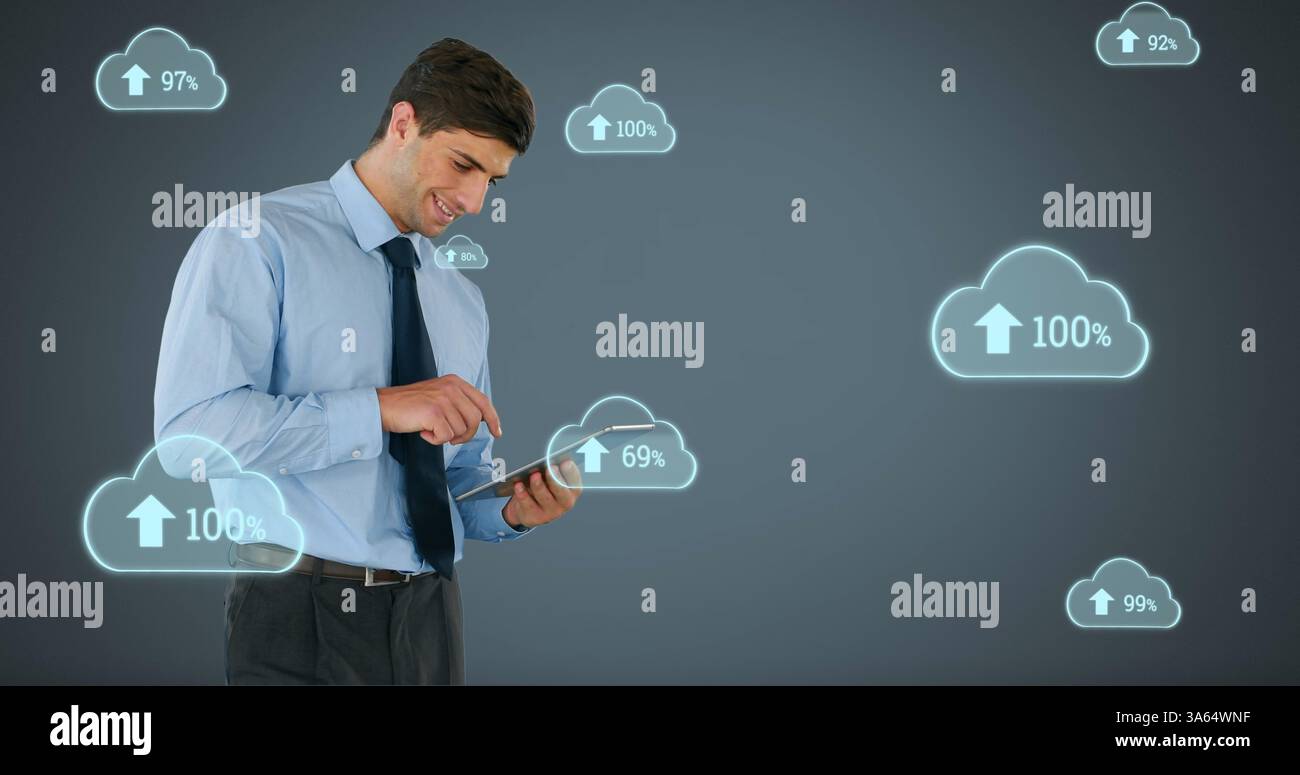 Businessman using tablet with cloud computing icons, analyzing data trends Stock Photo