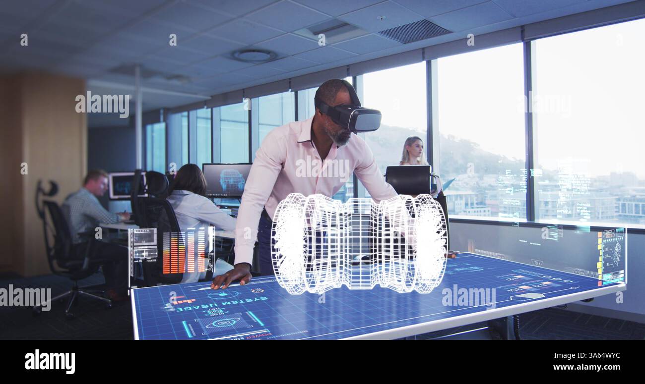 Using VR headset, engineer interacting with holographic interface in modern office Stock Photo